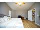 Spacious main bedroom with vaulted ceiling, including a desk area, a ceiling fan, and a comfortable bed at 1750 E Erie St, Gilbert, AZ 85295