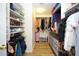 Spacious walk-in closet with organized shelving and hanging racks to keep your wardrobe in order at 1750 E Erie St, Gilbert, AZ 85295