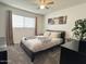 Serene bedroom with a ceiling fan, a queen bed, and soft natural light at 1801 N 87Th Pl, Scottsdale, AZ 85257