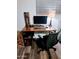 A home office desk area showcasing wood flooring and a craftsman style lamp at 1801 N 87Th Pl, Scottsdale, AZ 85257