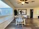 Comfortable dining room features modern table, chairs and a large window at 1801 N 87Th Pl, Scottsdale, AZ 85257