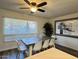 Bright dining room features modern table and a ceiling fan at 1801 N 87Th Pl, Scottsdale, AZ 85257