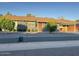 Charming single-story home featuring a well-maintained front yard and covered parking at 1801 N 87Th Pl, Scottsdale, AZ 85257