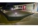 Nighttime view of the front yard with desert landscaping and charming outdoor lighting at 1801 N 87Th Pl, Scottsdale, AZ 85257
