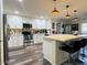Bright eat-in kitchen boasts stainless appliances, quartz counters, and modern pendant lighting at 1801 N 87Th Pl, Scottsdale, AZ 85257