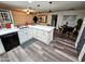 Bright kitchen with white cabinets, modern appliances, and wood-style floors, perfect for cooking and entertaining at 1801 N 87Th Pl, Scottsdale, AZ 85257