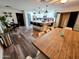 Modern kitchen features white cabinets, stainless steel appliances, an island, and an adjacent dining area at 1801 N 87Th Pl, Scottsdale, AZ 85257