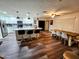 Modern kitchen features white cabinets, stainless steel appliances, an island, and an adjacent dining area at 1801 N 87Th Pl, Scottsdale, AZ 85257