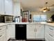 Modern kitchen with stainless steel appliances, stylish backsplash, and ample counter space at 1801 N 87Th Pl, Scottsdale, AZ 85257