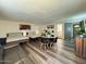 Open living area with two beds, dining table, a kitchenette, and a comfortable sofa at 1801 N 87Th Pl, Scottsdale, AZ 85257