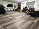 Expansive living area featuring a brick fireplace, entertainment center, and comfortable seating arrangement at 1801 N 87Th Pl, Scottsdale, AZ 85257