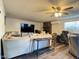 Spacious living room with comfortable seating and a large-screen television at 1801 N 87Th Pl, Scottsdale, AZ 85257
