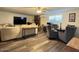 Inviting living room is furnished with a comfortable beige sofa at 1801 N 87Th Pl, Scottsdale, AZ 85257