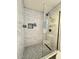 Modern shower with sleek glass enclosure, rainfall showerhead, and stylish tile accents at 1801 N 87Th Pl, Scottsdale, AZ 85257