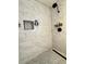 Close-up of the modern shower with sleek fixtures, rainfall showerhead, and mosaic tile accents at 1801 N 87Th Pl, Scottsdale, AZ 85257