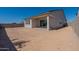 The home's backyard offers privacy, block fencing, and the home's rear covered patio at 18047 W Long Lake Rd, Goodyear, AZ 85338