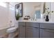 This bathroom features a single sink vanity, toilet, and a bathtub with shower at 18047 W Long Lake Rd, Goodyear, AZ 85338