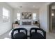 Sunlit bedroom featuring neutral decor, plush carpeting, and picturesque windows at 18047 W Long Lake Rd, Goodyear, AZ 85338