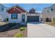 Charming single-Gathering home featuring a two-car garage, contrasting trim, and low maintenance desert landscaping at 18047 W Long Lake Rd, Goodyear, AZ 85338