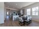 Bright eat-in kitchen features grey cabinets, granite countertops, and stainless steel appliances at 18047 W Long Lake Rd, Goodyear, AZ 85338