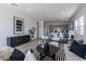 Stylish living room featuring contemporary decor and an open floor plan to the kitchen at 18047 W Long Lake Rd, Goodyear, AZ 85338