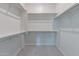 Spacious walk-in closet with ample shelving and rod space for organization at 18047 W Long Lake Rd, Goodyear, AZ 85338