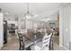 Bright dining area adjacent to the kitchen and living room, ideal for Gathering meals and gatherings at 18203 W Port Royale Ln, Surprise, AZ 85388