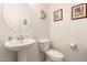 Bathroom featuring pedestal sink and toilet at 18241 W Foothill Dr, Surprise, AZ 85387