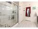 Bathroom featuring glass enclosed shower and easy access door at 18241 W Foothill Dr, Surprise, AZ 85387