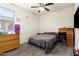 Cozy bedroom features a dresser and fan at 18241 W Foothill Dr, Surprise, AZ 85387