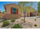 Charming single-story home boasts a well-maintained desert landscape and convenient drive-through garage at 18241 W Foothill Dr, Surprise, AZ 85387