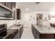 Kitchen showcasing granite counters and stainless steel microwave at 18241 W Foothill Dr, Surprise, AZ 85387