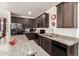 The kitchen features granite countertops and stainless steel appliances at 18241 W Foothill Dr, Surprise, AZ 85387