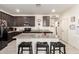 Features granite countertops and an island with bar seating at 18241 W Foothill Dr, Surprise, AZ 85387