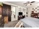 Main bedroom showcasing sliding barn door and mounted TV at 18241 W Foothill Dr, Surprise, AZ 85387