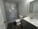 A bathroom features a vanity with new sink and a grey-tiled walk-in shower at 2045 E Orange St, Tempe, AZ 85281