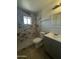Bathroom features marble-look shower and updated vanity at 2045 E Orange St, Tempe, AZ 85281