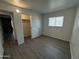 Spacious bedroom featuring neutral paint, laminate flooring, and a closet at 2045 E Orange St, Tempe, AZ 85281