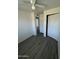 This bedroom features wood-look floors and a closet with bi-fold doors at 2045 E Orange St, Tempe, AZ 85281