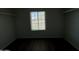 Walk in closet with laminate flooring, a window, and hanging rods at 2045 E Orange St, Tempe, AZ 85281