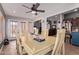 Open-concept dining area with a large table and a view of the living room and kitchen at 20769 N 106Th Ln, Peoria, AZ 85382