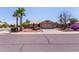 Charming single-story home featuring a tile roof, a two-car garage, and well-maintained desert landscaping at 20769 N 106Th Ln, Peoria, AZ 85382