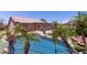 Sparkling pool surrounded by lush landscaping and a screened in porch, perfect for relaxation at 20769 N 106Th Ln, Peoria, AZ 85382
