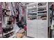 Spacious walk-in closet with custom shelving and ample storage space for clothes and accessories at 20769 N 106Th Ln, Peoria, AZ 85382