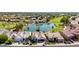 Aerial view of houses near a green golf course and lake offering tranquil community living at 21480 N 56Th Ave, Glendale, AZ 85308