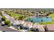 Captivating aerial view of a suburban neighborhood near a golf course and shimmering lake at 21480 N 56Th Ave, Glendale, AZ 85308