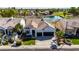 Stunning aerial view of a well-maintained home with a manicured lawn, pool and golf course at 21480 N 56Th Ave, Glendale, AZ 85308