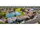 An aerial view shows the property on a green golf course with a beautiful lake nearby at 21480 N 56Th Ave, Glendale, AZ 85308