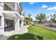 Spacious backyard featuring a covered patio, well-maintained lawn, and mature trees at 21480 N 56Th Ave, Glendale, AZ 85308
