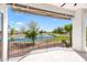 This covered balcony offers beautiful water views of a lake and golf course at 21480 N 56Th Ave, Glendale, AZ 85308